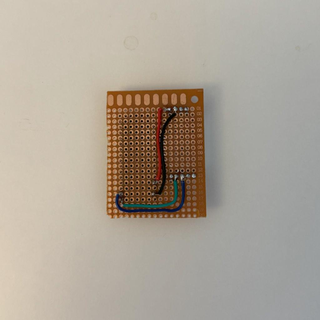 Back side of perfboard with soldered wires